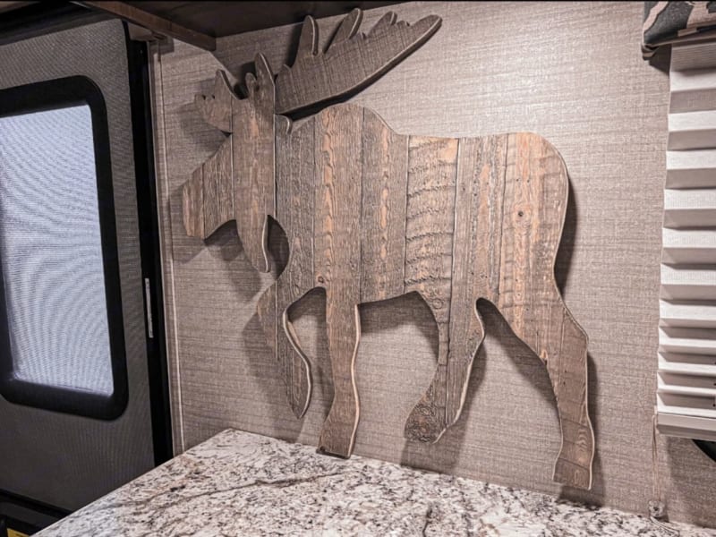 Moose will greet you when you walk in the door. Our one dog is named Moose, so we decided to make this the theme. 