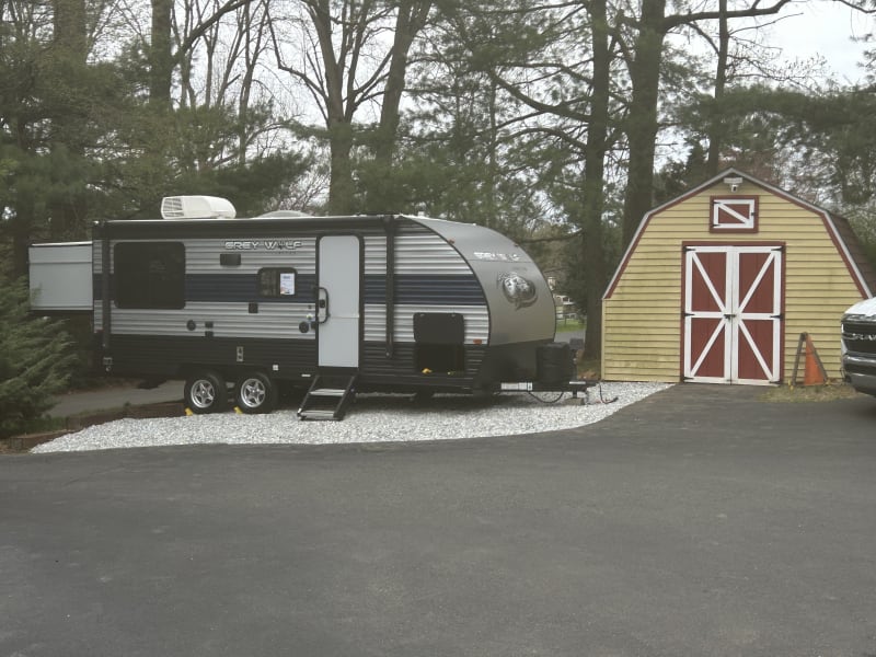 Slide of queen bed out back adds 4 feet to overall length when set up at site.