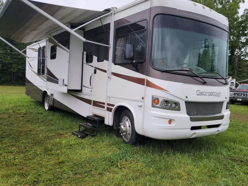 Exterior with awning and slides out.