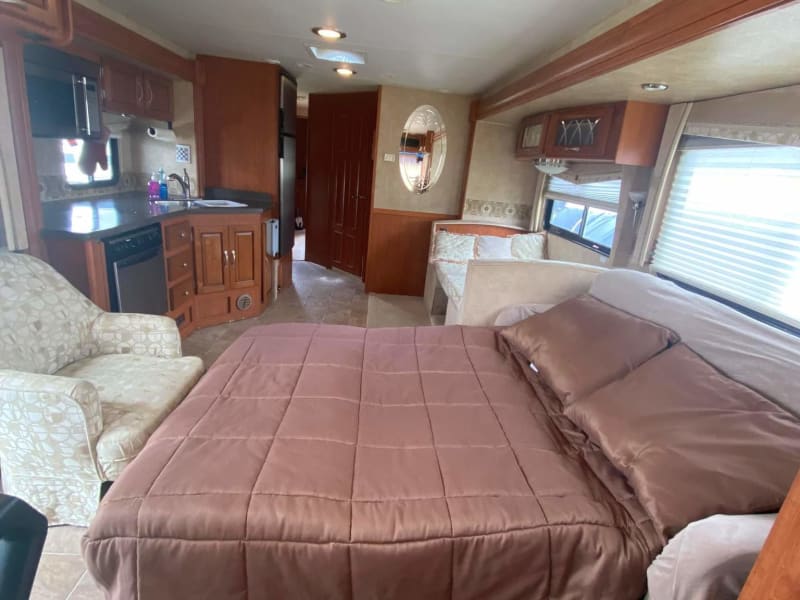 Living room with sleeper sofa out. 