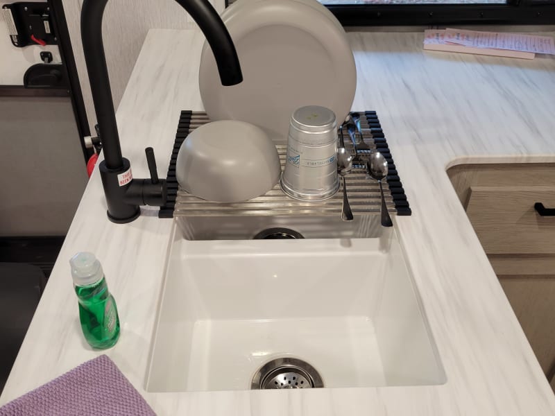 Double sink, shown with dish draining rack.