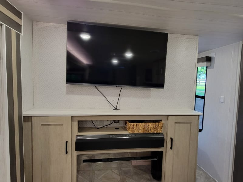 Fireplace with heat or without. Large TV with sound bar. Will connect to Bluetooth.