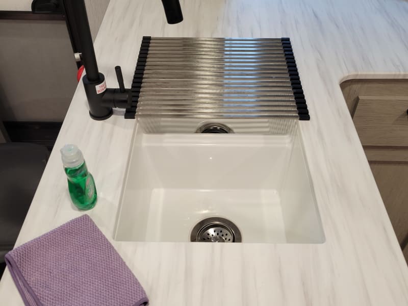 Double sink with dish drying rack.