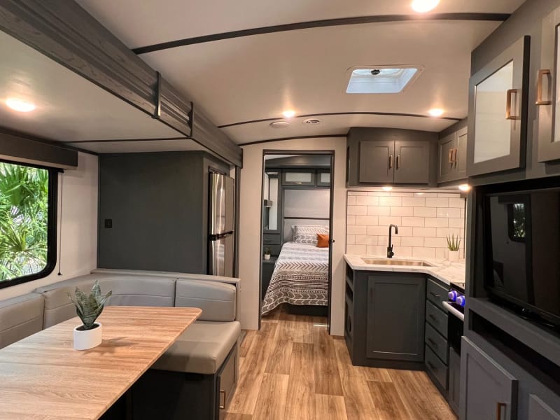 With the dinette and residential refrigerator located in the slide out, the living area is both spacious and bright.