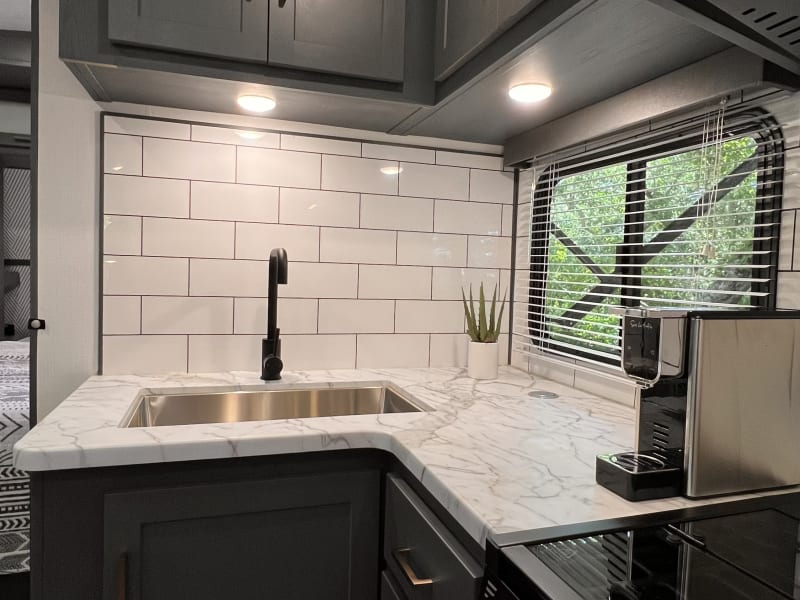 A Nespresso OL (original line) espresso machine is provided for your daily use!