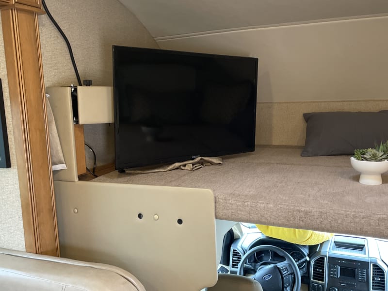 There’s a picture of the loft with the TV that can turned for the whole coach