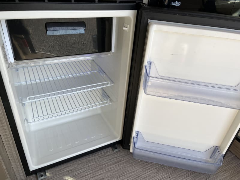 3.1cf refrigerator with freezer with upper freezer compartment. Temperature can be adjusted with dial inside. 