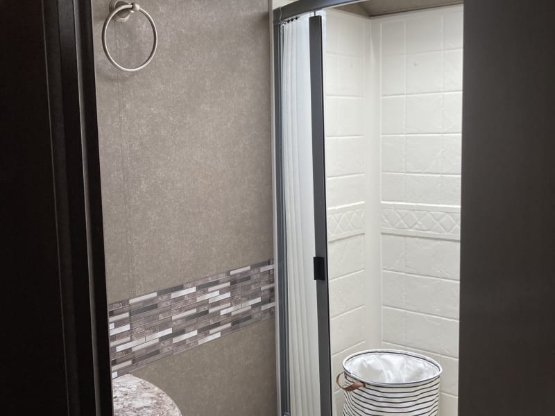 Large shower, two storage cabinets 