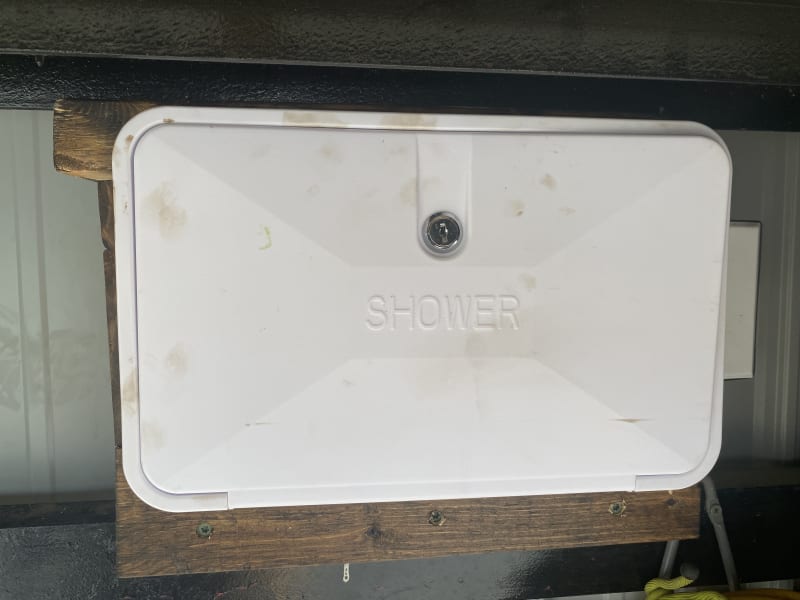 Outside shower unit with hot and cold water