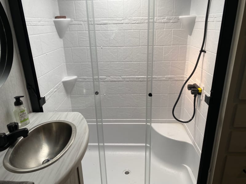 Spacious shower awaits! This master bath features a full-sized shower for a luxurious and refreshing experience. Step in and enjoy ultimate comfort!
