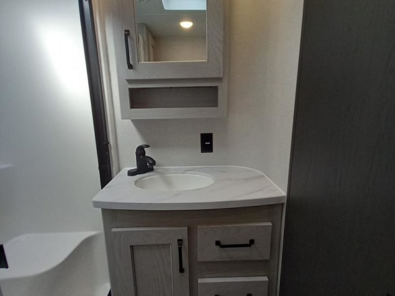 Master Bath w/ Standup shower and bench.