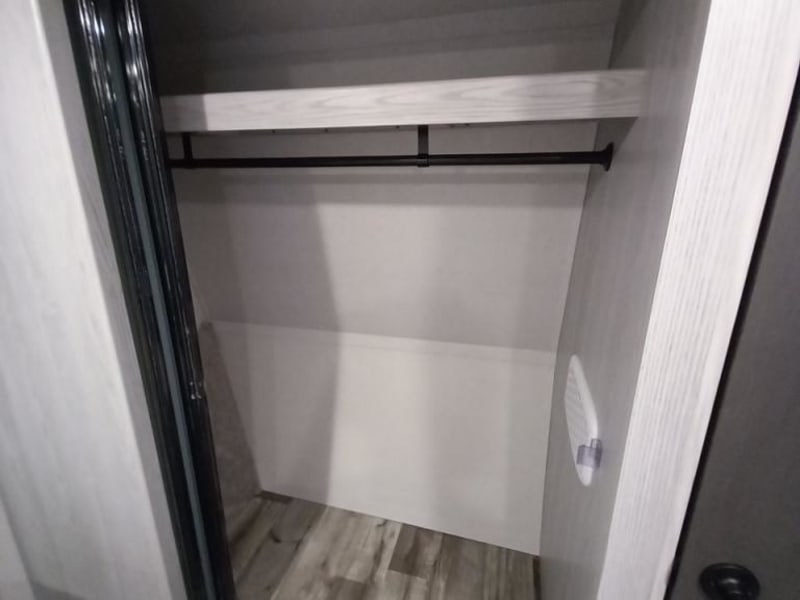 Master closet with lots of space for hanging clothes.