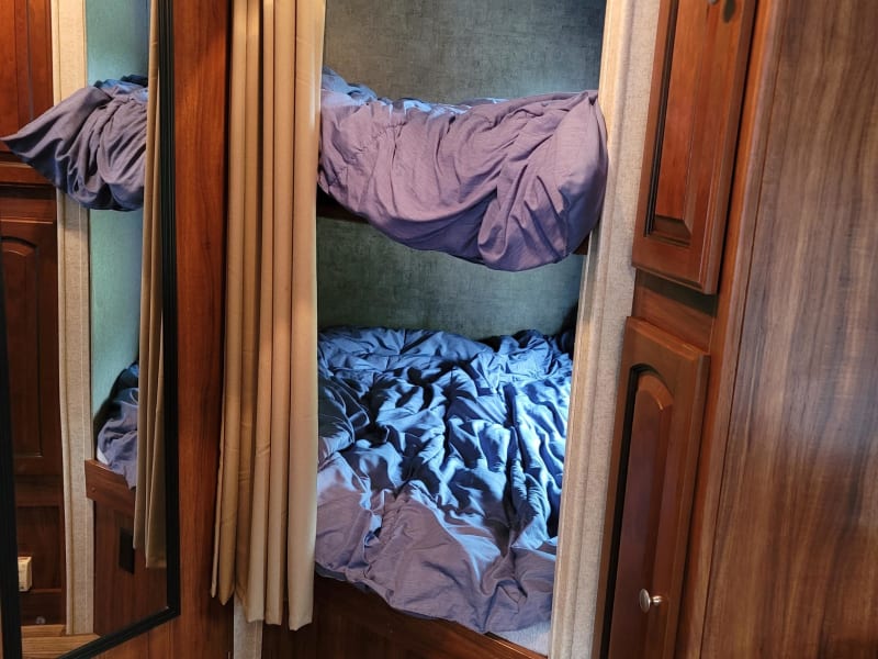 2 Full size bunks includes linens and windows for quick escape and fresh air.