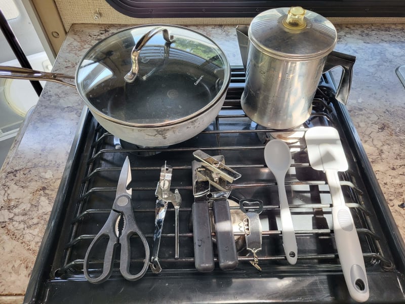 Coffee pot, sauce pan, and utensils.