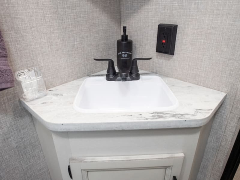 Bathroom Sink With Soap Dispenser and Toothbrush Holder
