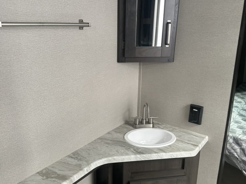 Bathroom sink with storage under and to the left
