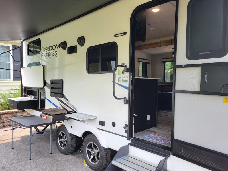 Door side view of camper. 