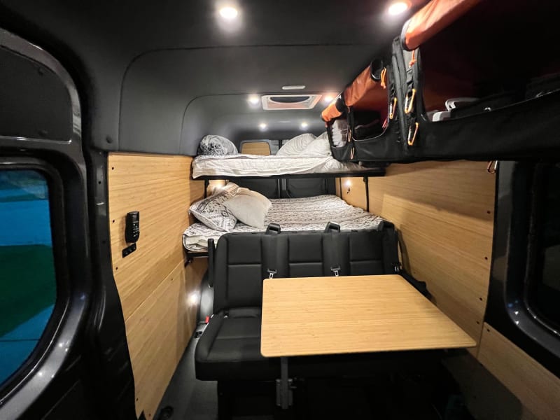 The back passenger seats can come out! let us know if you need the second row or if you want some more space!