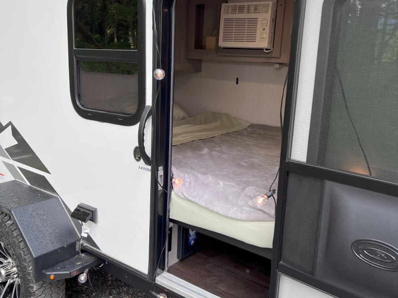 There's an entrance on each side of the trailer, and each entrance has a metal step that is folded away when driving.