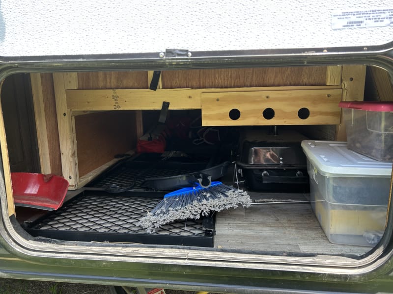 Storage contains a broom/dustpan, fire starting supplies, a small grill, four chairs and a campfire grate.  Firewood can be provided for an added fee.