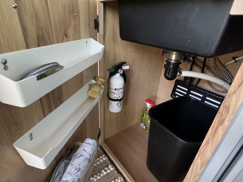 Under Sink storage: Trash, bins, fire extinguisher
