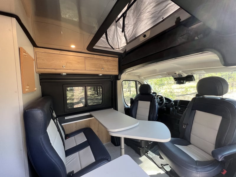 Cabin seats swivels for dining. The dining table has an extension with 2 positions one for eating and one to make more counter space for cooking.