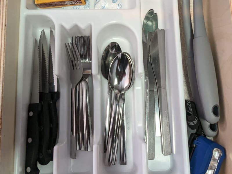 Forks, spoons and knives for 5 provided. Plastic serving and cooking utensils provided as well.