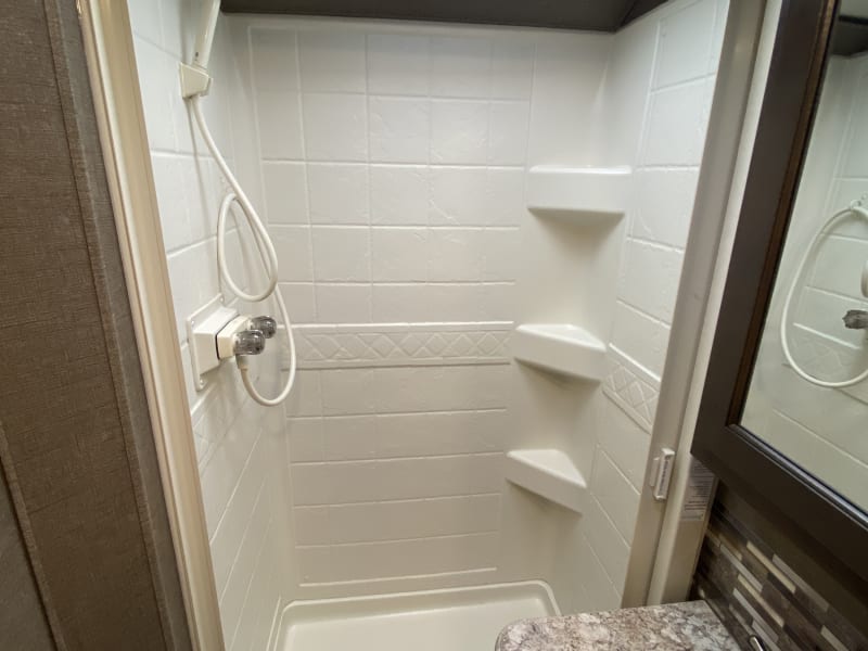 This shower will accommodate most humans. Super clean and ready to roll. 