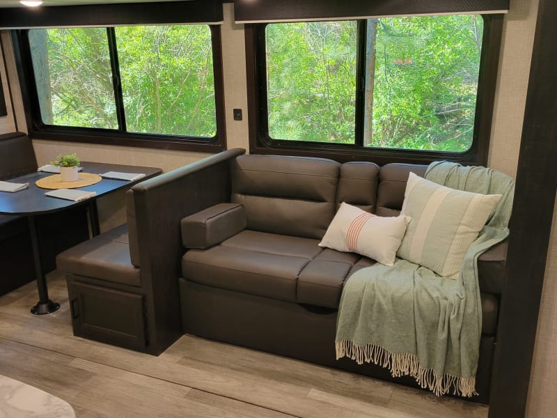 Dinette and couch (both fold down for extra sleeping areas).  