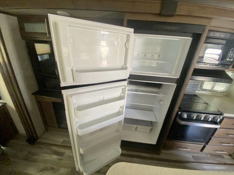 Full size Fridge, Microwave , Stove top with 3 burners and oven. 