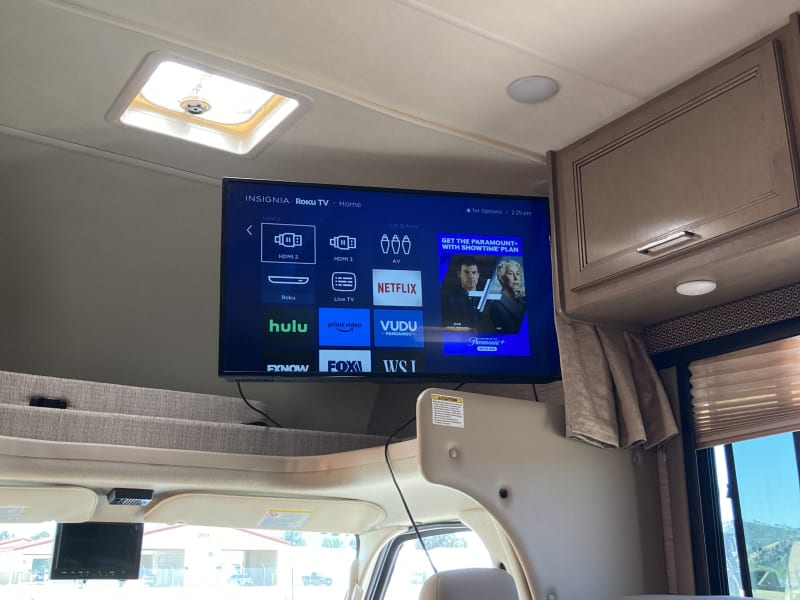 Roku Smart TV which can run while driving for your passenger’s entertainment. 