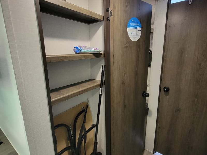 This is a pantry for your food, and it also holds the folding table.