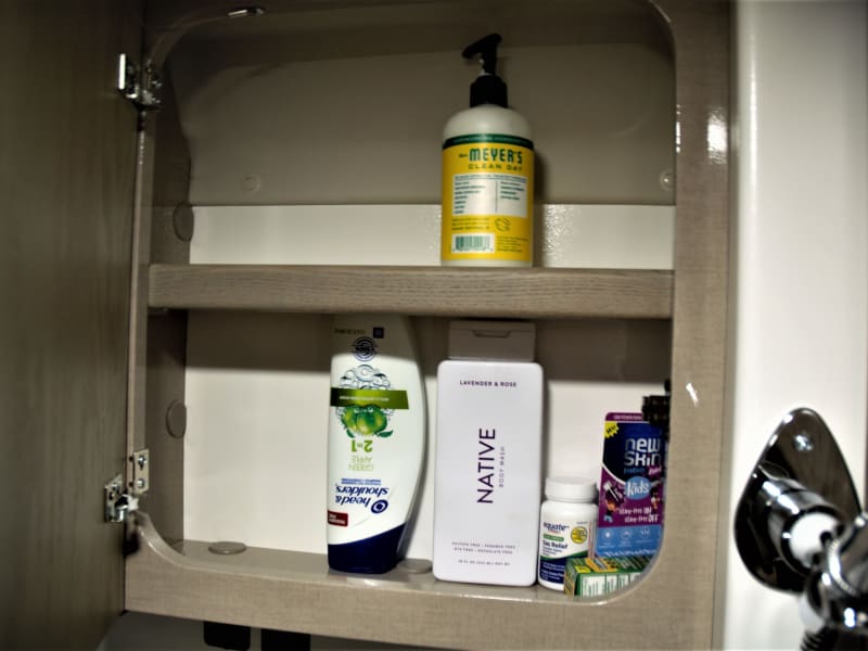 Medicine cabinet with supplied shampoo and bodywash.