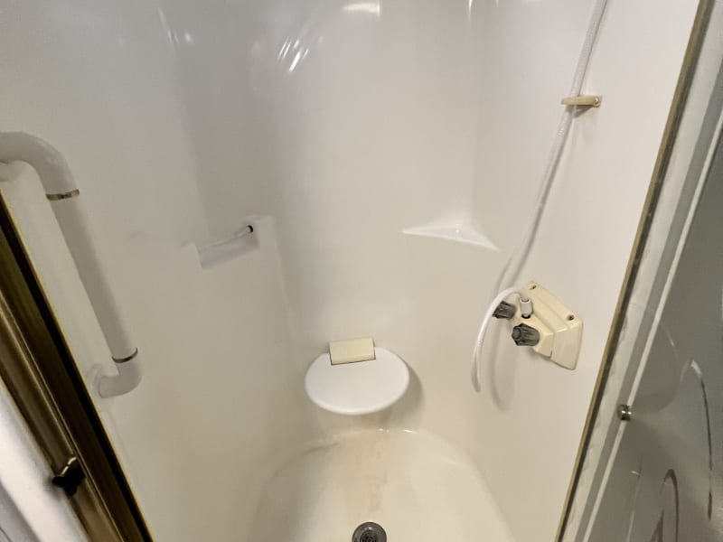 Spaciouse shower with a flip down seat