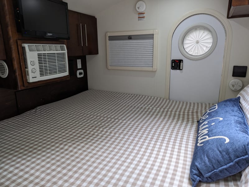 Windows can be opened and are equipped with screens and privacy shades.