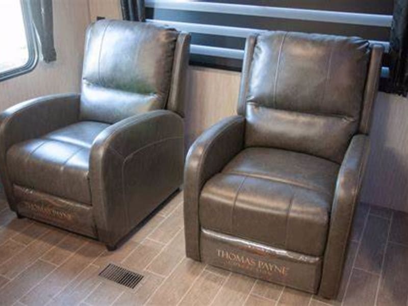Lounge in style in matching leather recliners 