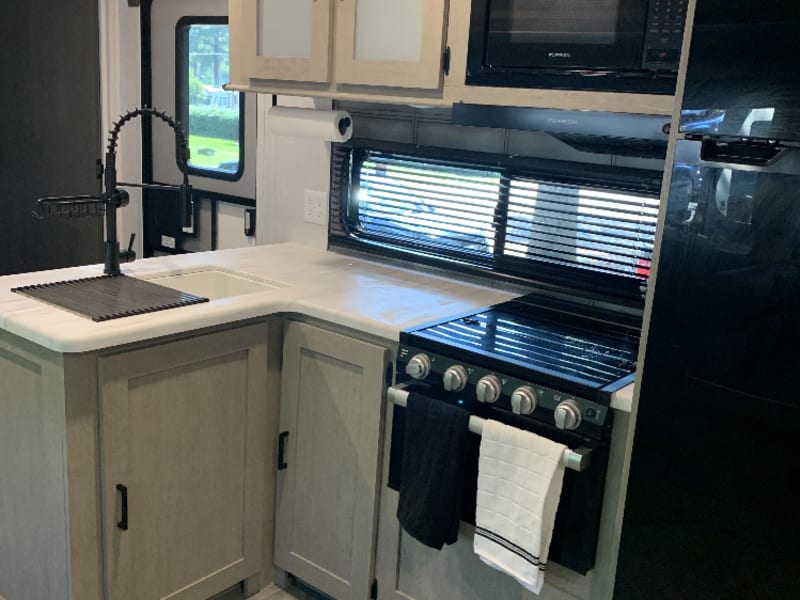 Microwave, 3 burner cook top and oven.  