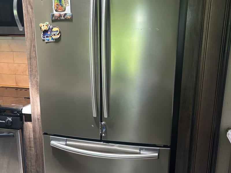 large residential fridge/freezer with ice maker