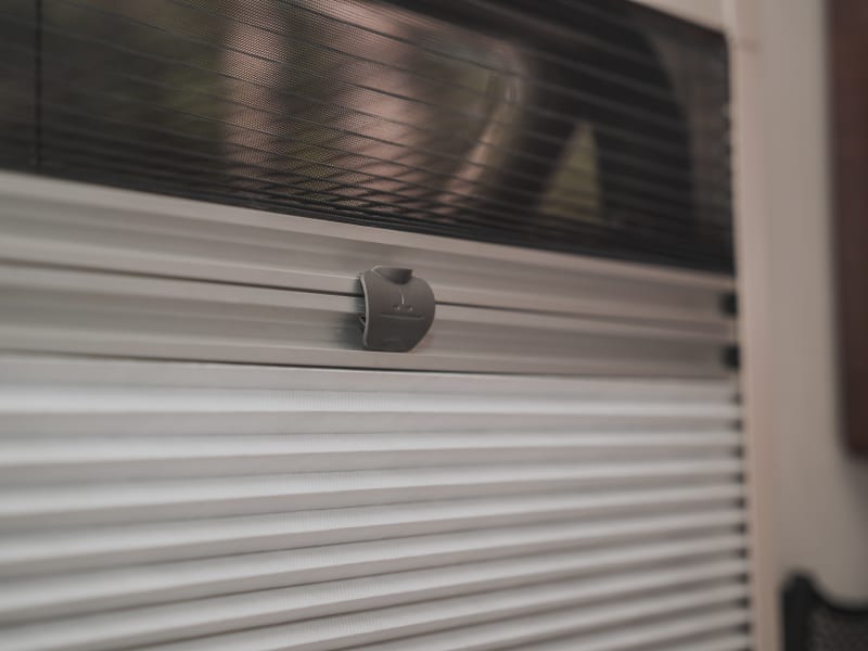 Windows have both blinds and screens to protect from the heat and bugs.