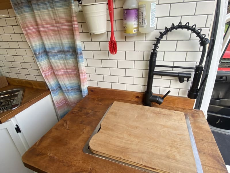 Extra cutting board space fits over sink