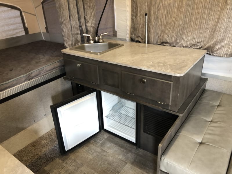 Interior sink and mini fridge. 