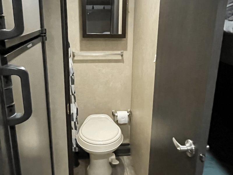 Toilet and medicine cabinet