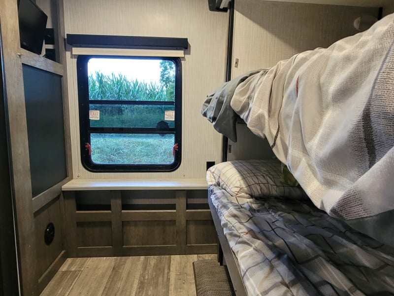 Bunkroom with TV & storage space under bottom bunk