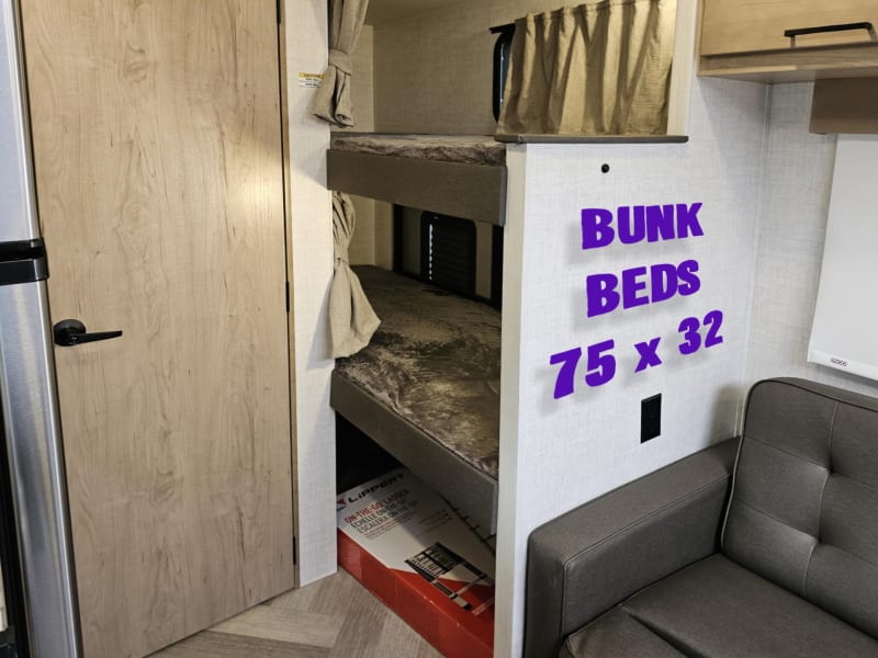 Two bunks with private lighting, usb ports built in, and privacy shade.