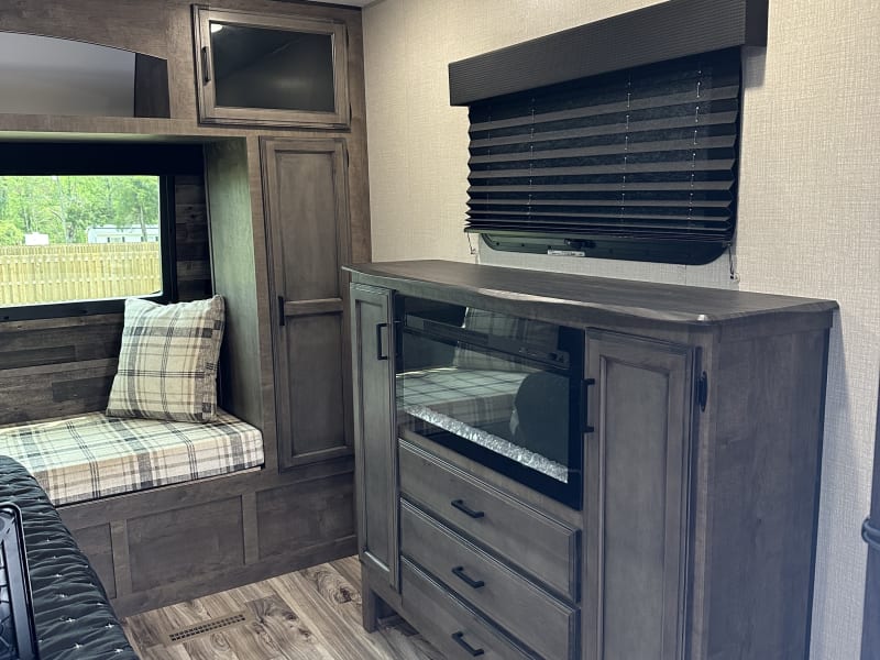 Master bedroom fireplace and dresser/entertainment center