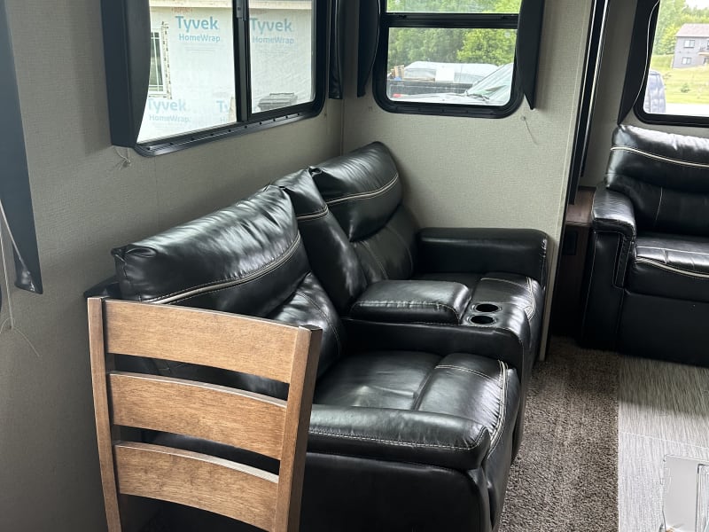 Two recliners with cupholders.  