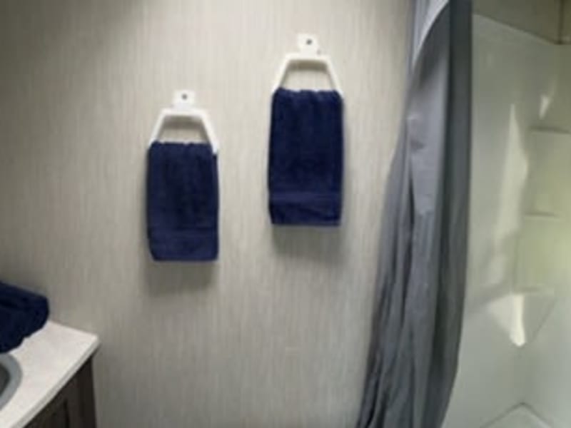 Private bath with a separate toilet (ceramic, not plastic, and w/ a bidet) and shower.  4 bath towels, hand towels, and wash cloths provided