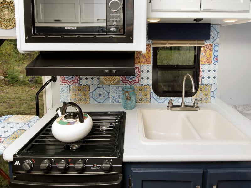 Cook all your camping favorites in this great kitchen. 3 burner stove, oven and microwave it has you covered!