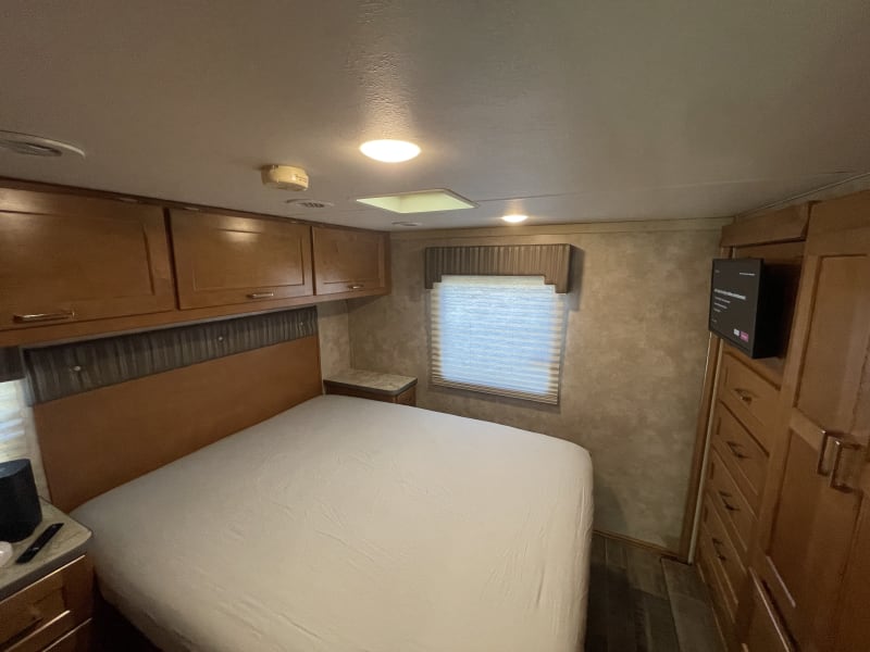 Queen size bed in bedroom