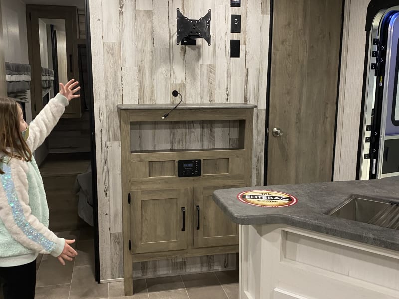 Living area with Tv Mount capabilities and a radio with bluetooth 